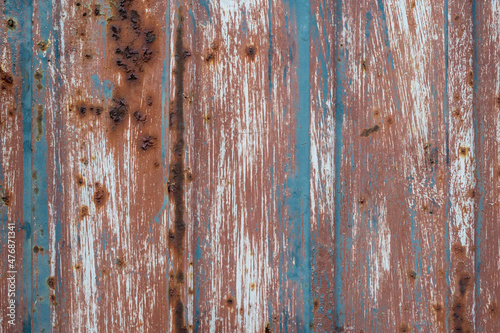 Grunge rust background. Scratched metal texture. Peeling paint background. Blue rusty brushed iron sheet. Cracked steel pattern. Industrial backdrop for graphic design.