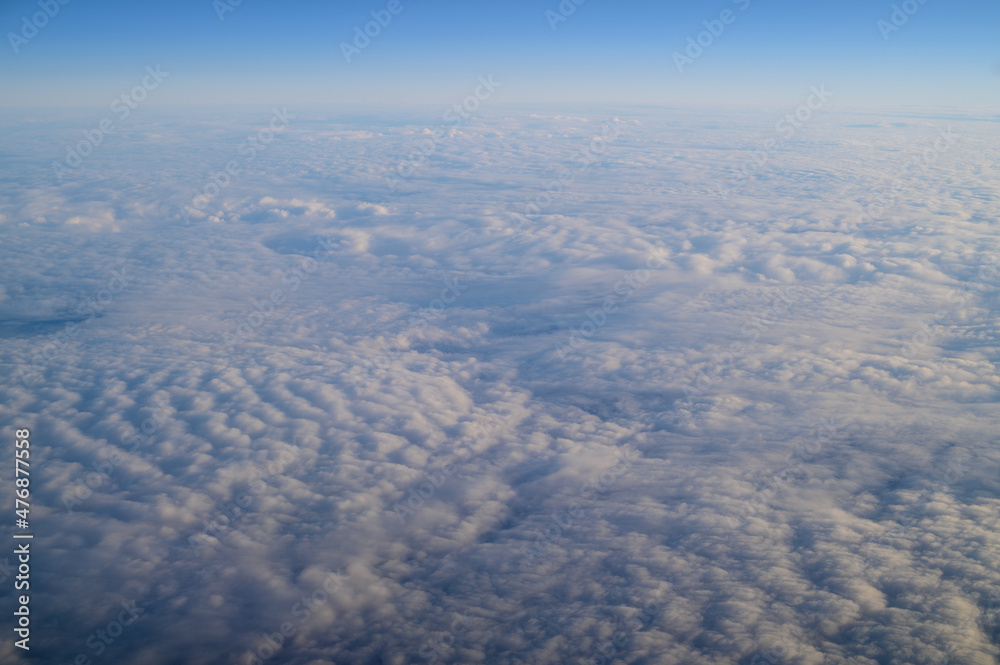 the view of the clouds from the airplane window2 the view of the clouds from the airplane window2