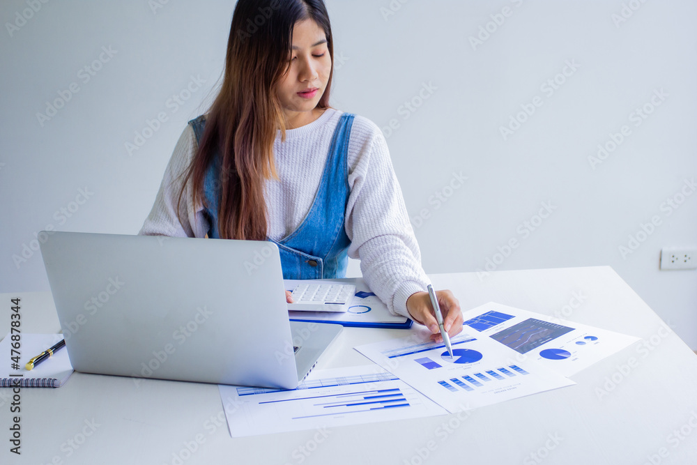 The sales manager points out the company's past sales, cropped image of working woman of her own company by self-checking and troubleshooting, new business ideas. The sales manager points out the company's past sales, cropped image of working woman of her own company by self-checking and troubleshooting, new business ideas.