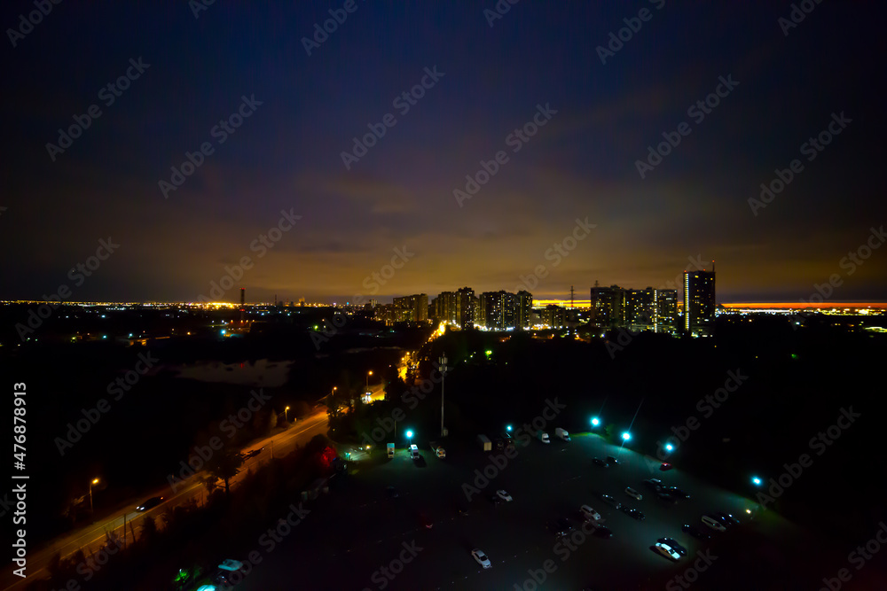 high-rise residential building close-up, night photo 