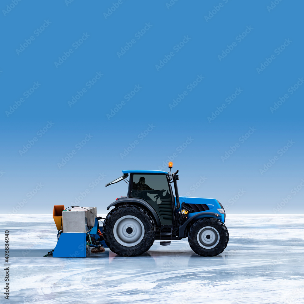 Side view of a new tractor and a resurfacer maintenance machine polishing a big ice field into a skating rink under a clear blue winter sky with copy space on ice surface Side view of a new tractor and a resurfacer maintenance machine polishing a big ice field into a skating rink under a clear blue winter sky with copy space on ice surface