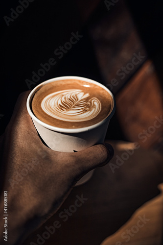 Selective focus cup of hot latte art coffee