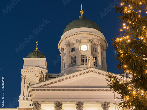 Christmas tree on the background of St. Nicholas Cathedral in Helsinki.