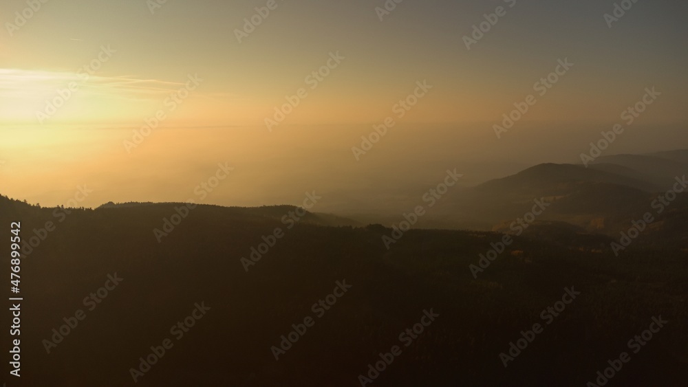 Sunrise in the Jizera mountains. Forest and fog.