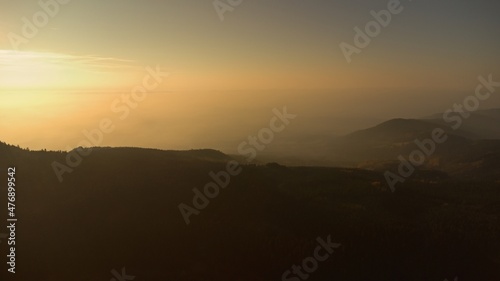 Sunrise in the Jizera mountains. Forest and fog.