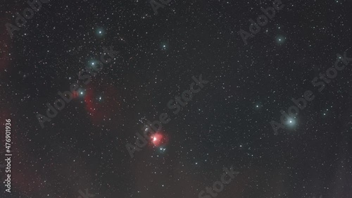 stabilized constellation Orion and nebulae in the night sky with occasional fog 