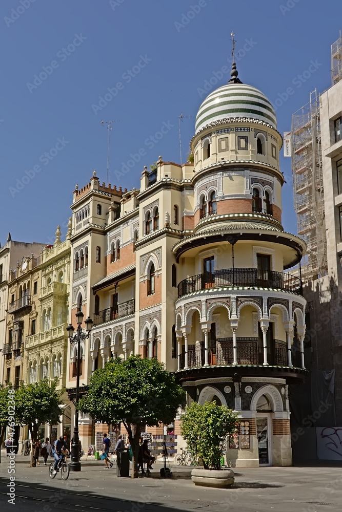Posh historical Andalusian house with tower on a sunny day with clear blue sky in Seville, Spain 