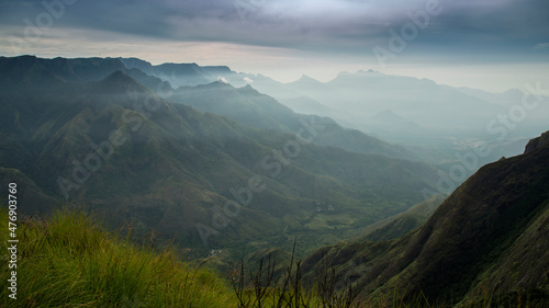 Amazing mountain landscape with clouds, tea estate natural outdoor travel background. Beauty world. © SivaG