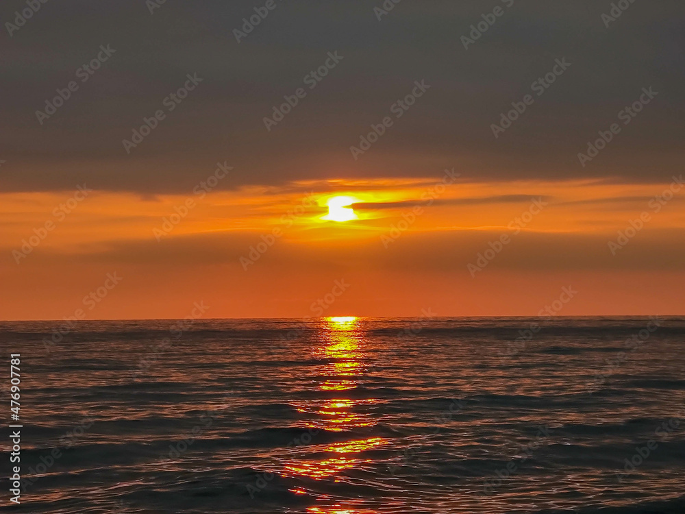 evening november sky with sunset over mediterranean sea/beach  at autumn
