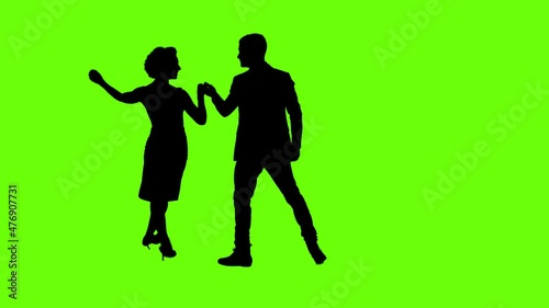 A Young couple dancing tango profesional dancers on Green Screen Silhouette Pair in argentinian spanish dress performs dance movement. 4K 60fps Argentina France Chroma key Argentina Buenos Aires Messi photo