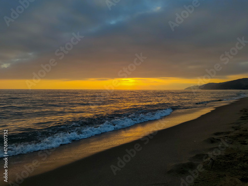 evening november sky with sunset over mediterranean sea/beach at autumn 