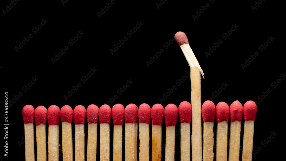 matches in a row on a black background. matches in a row on a black background.