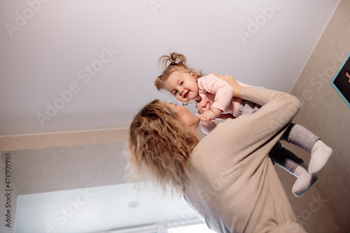 child playing with their mom