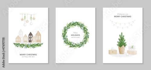 Set of greeting cards Merry Christmas and Happy New Year in Scandinavian style. Wooden houses, a festive wreath with greenery, a small pine tree wrapped in craft paper, gifts. © Julia Laime