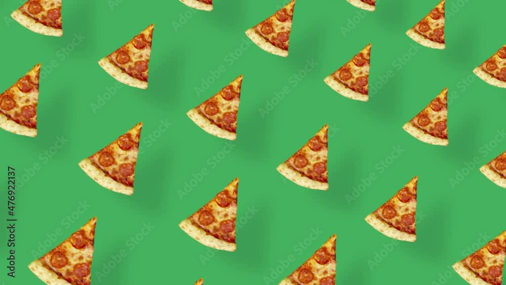 Colorful pattern of pizza isolated on green background with shadows. Seamless pattern with pizza slices. Top view. Realistic animation. 4K video motion