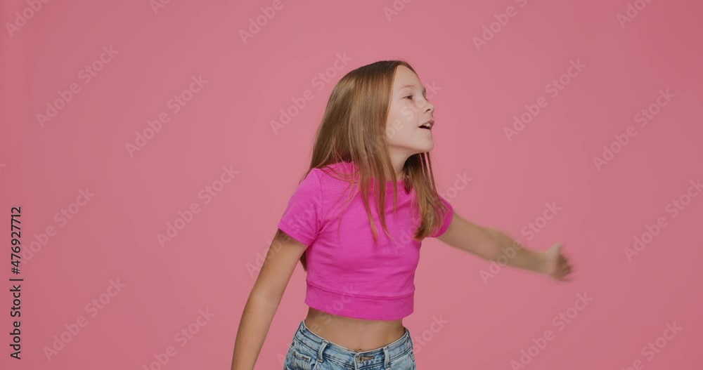 Cute child girl blogger blowing air kisses, make heart gesture, greeting or goodbye. Love and gratitude gesturing Cute child girl blogger blowing air kisses, make heart gesture, greeting or goodbye. Love and gratitude gesturing