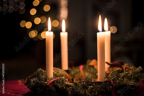 Christmas lighting with four candles on a table, holiday season