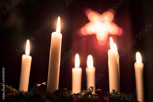 Christmas lighting with candles on a table, low point of view, holiday Season
