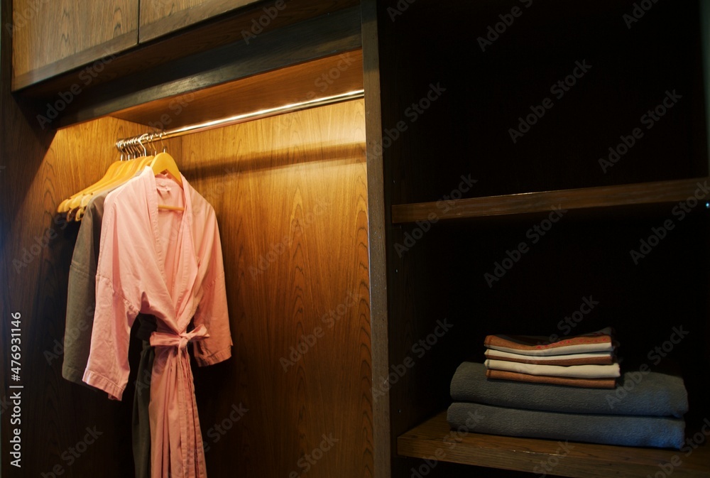clothes hanger and bathrobe in wardrobe clothes hanger and bathrobe in wardrobe