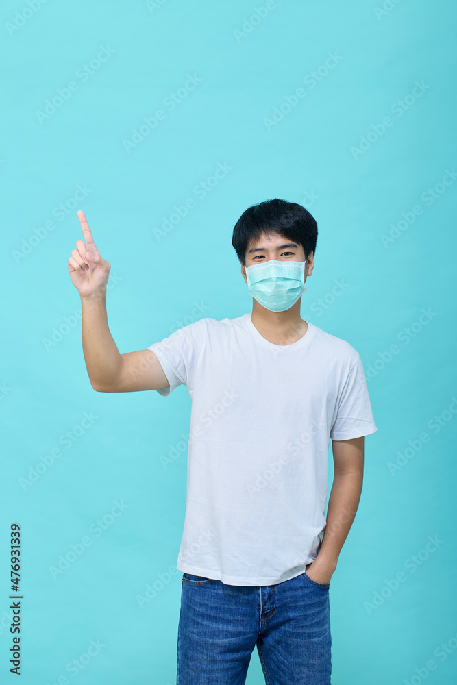 Young Asian man wear mask and present empty spaces