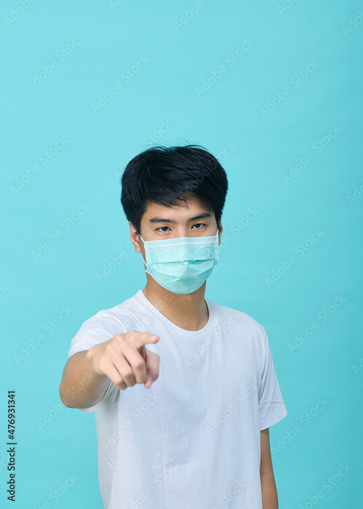 Young Asian man wear mask and present empty spaces Young Asian man wear mask and present empty spaces