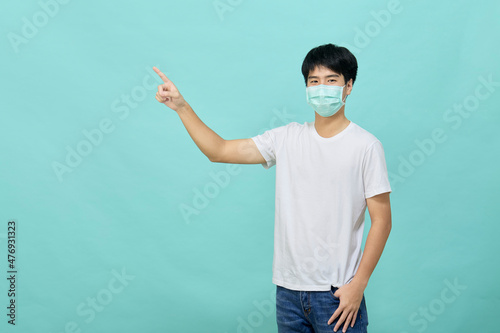 Young Asian man wear mask and present empty spaces
