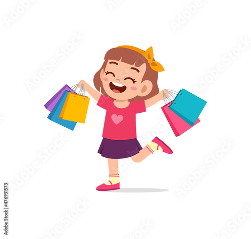 cute little girl carry many sopping bags
