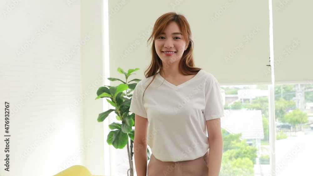 Portrait charming, good-humored happy and healthy women stand in the living room dancing, having fun, looking at the camera smiling at you. Portrait charming, good-humored happy and healthy women stand in the living room dancing, having fun, looking at the camera smiling at you.