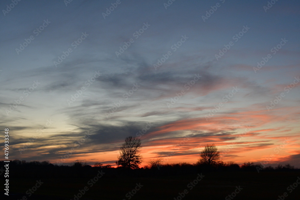 Colorful Sunset Over a Rural Field
