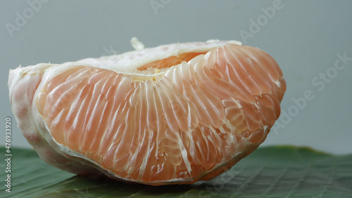 peeled tangerine on a black background