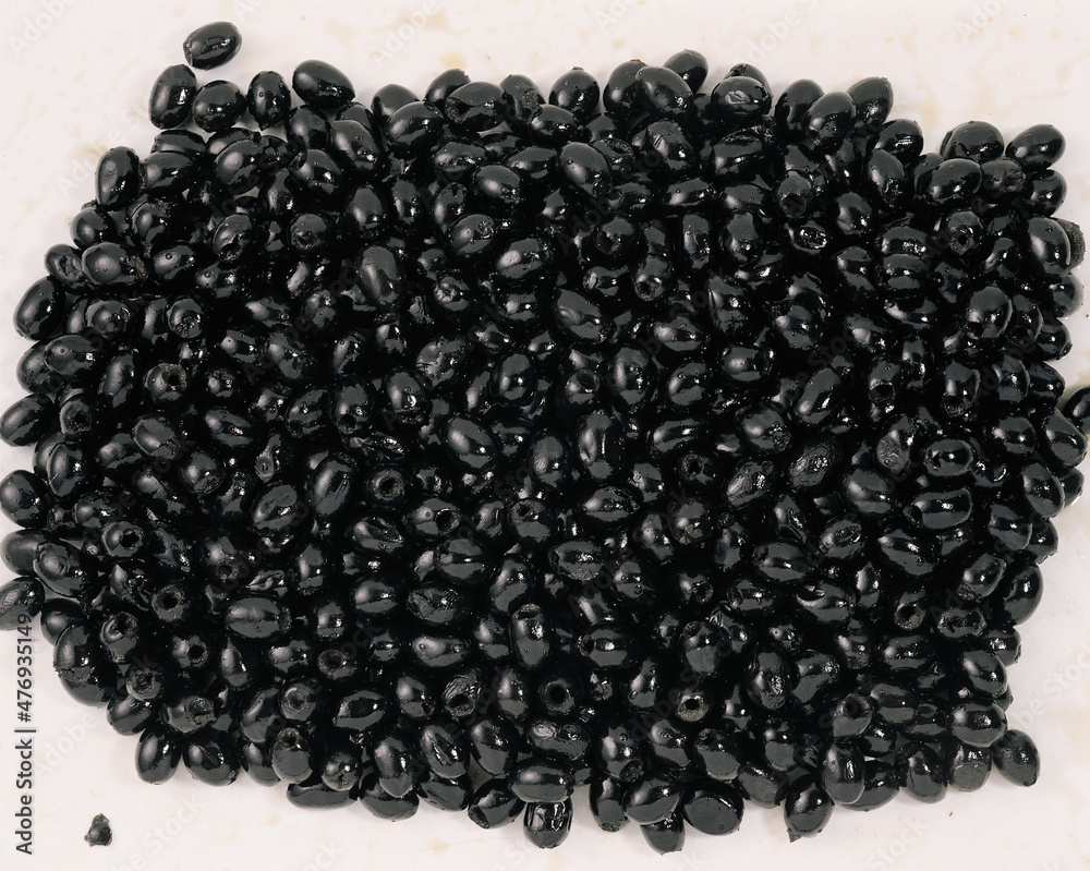 Smoked market fresh black olives as background Smoked market fresh black olives as background
