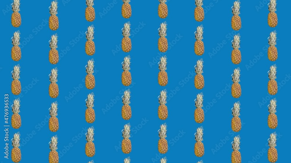 Colorful pattern of pineapples on blue background. Top view. Minimal tropical fruit summer concept. Seamless pattern with pineapple. 4K video motion Colorful pattern of pineapples on blue background. Top view. Minimal tropical fruit summer concept. Seamless pattern with pineapple. 4K video motion