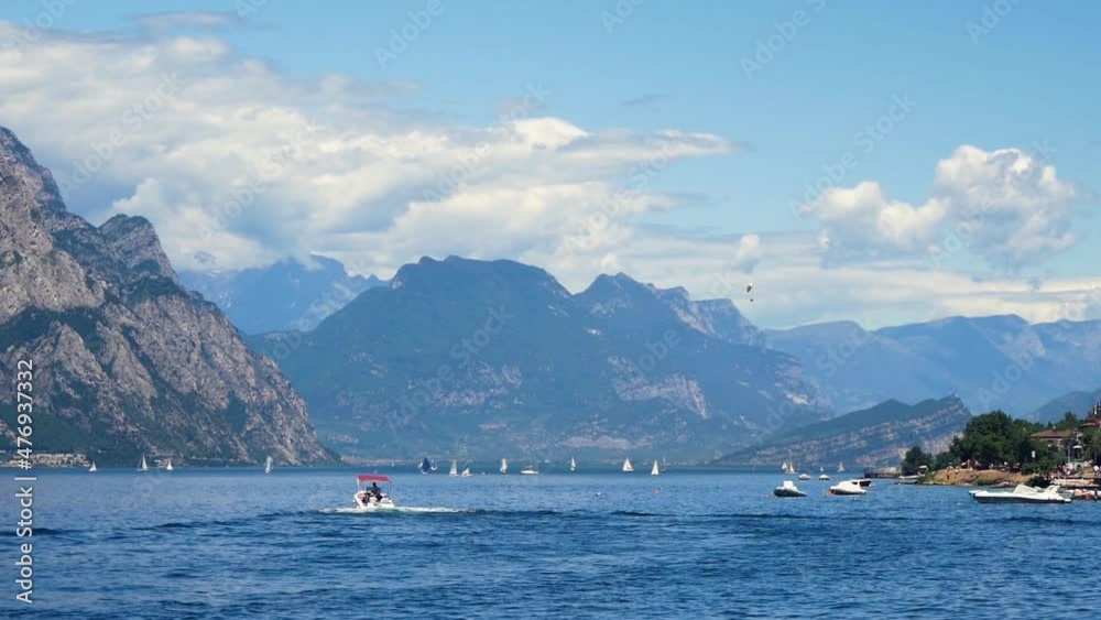 View Of The Lake With Rocky Shores And Many Boats In The Distance View Of The Lake With Rocky Shores And Many Boats In The Distance