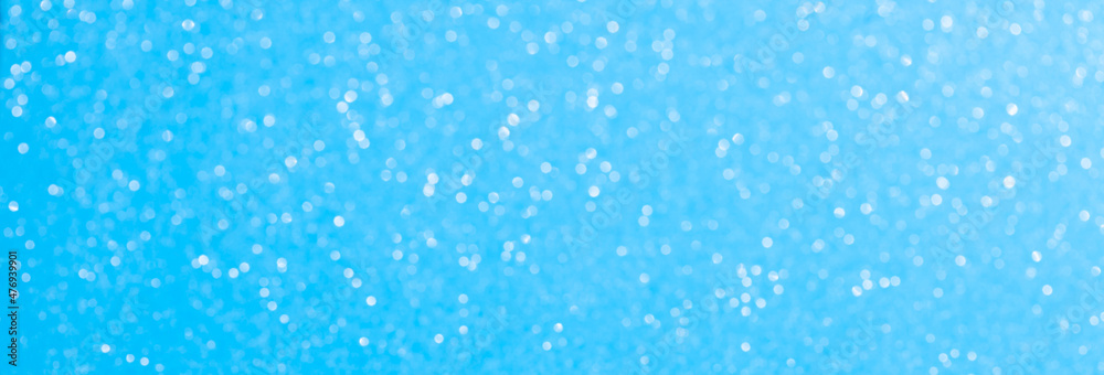 sparkles of Blue glitter abstract background. Copy space