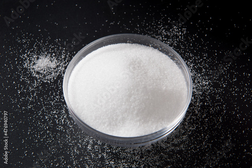 salt in a bowl on black background