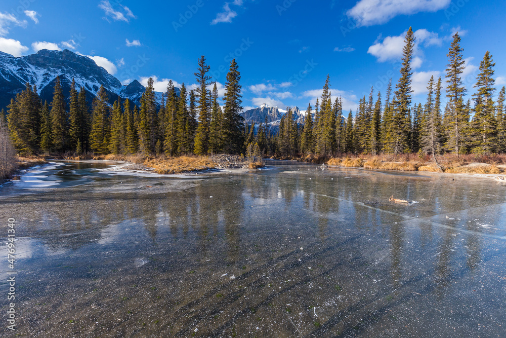 Three Sisters from a frozen Policemen's Creek in winter, Canada Three Sisters from a frozen Policemen's Creek in winter, Canada