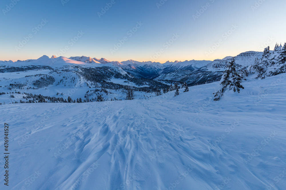 Rock Isle Lake, Sunshine Meadows cold sunset under blanket of snow in winter, Canada