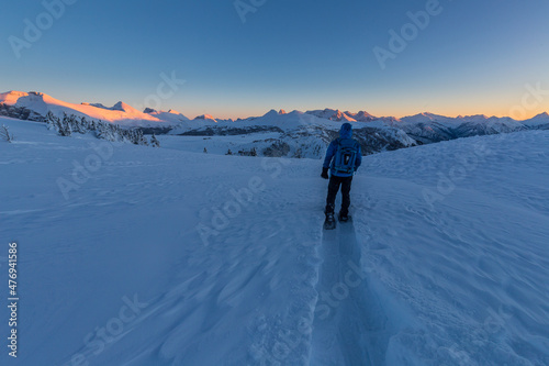 Snowshoe Sunshine Meadows cold sunset under blanket of snow in winter, Canada photo