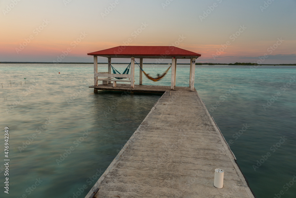 Caribbean sunset scene at Bacalar lagoon, Mexico Caribbean sunset scene at Bacalar lagoon, Mexico