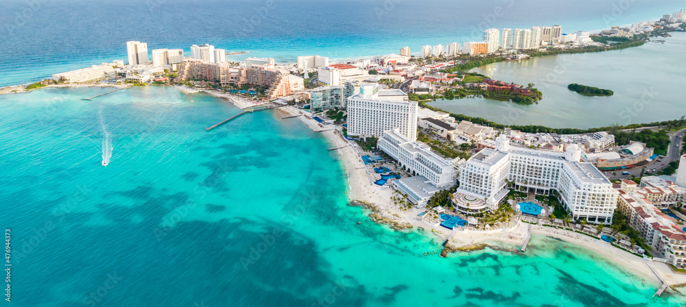 Aerial panoramic view of Cancun beach and city hotel zone in Mexico. Caribbean coast landscape of Mexican resort with beach Playa Caracol and Kukulcan road. Riviera Maya in Quintana roo region on - obrazy, fototapety, plakaty 