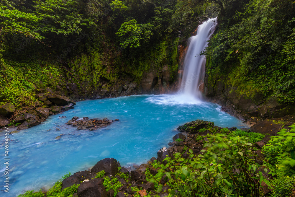 Waterfall and natural pool with turquoise water of Rio Celeste, Costa Rica