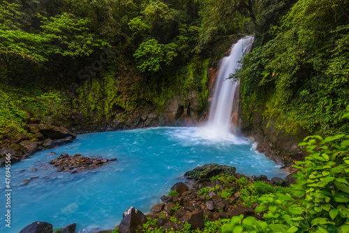 Waterfall and natural pool with turquoise water of Rio Celeste  Costa Rica
