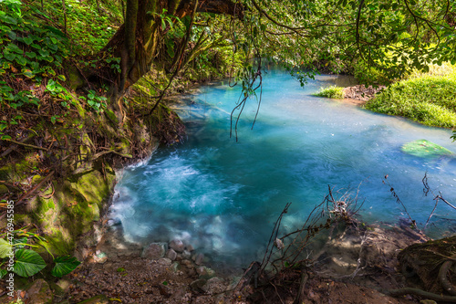 Two clear rivers with different acidity mix and create the river with turquoise water. Rio Celeste, Costa Rica