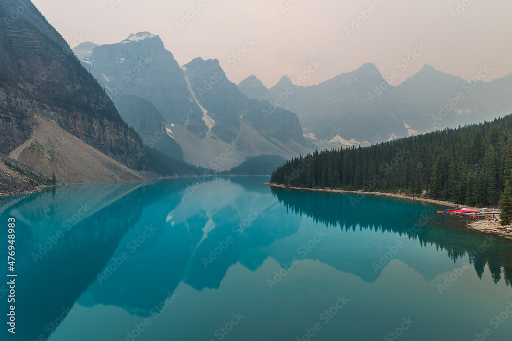View on smoky Morraine lake during wildfires, Rocky Mountains, Alberta, Banff, Canada