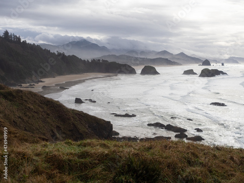Overlook of the Oregon Coast with Sandy Beach, Sea Stacks, and Distant Mountains
