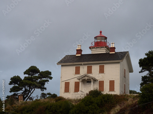 Two Story White Wooden Yaquina Bay Lighthouse From Below photo