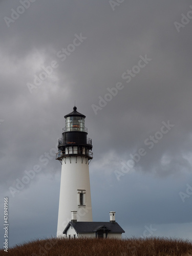 Oregon Coast s Yaquina Head Lighthouse with Storm Clouds Overhead