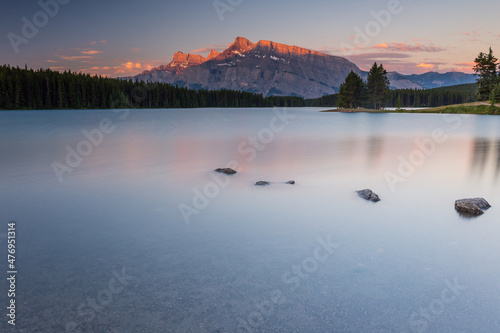Rundle Mountain reflecting in Two Jack Lake in Banff National Park at sunrise. © Pavel