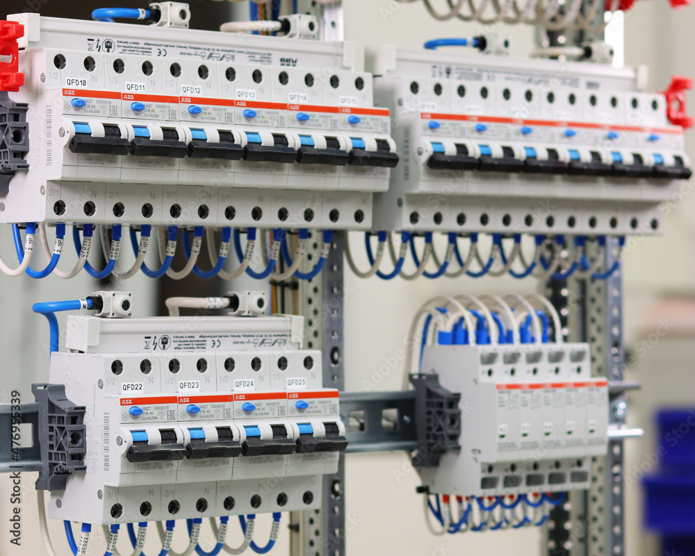 Differential electric current switches and 2-pole electromagnetic contactors for load control are located on the din rail.