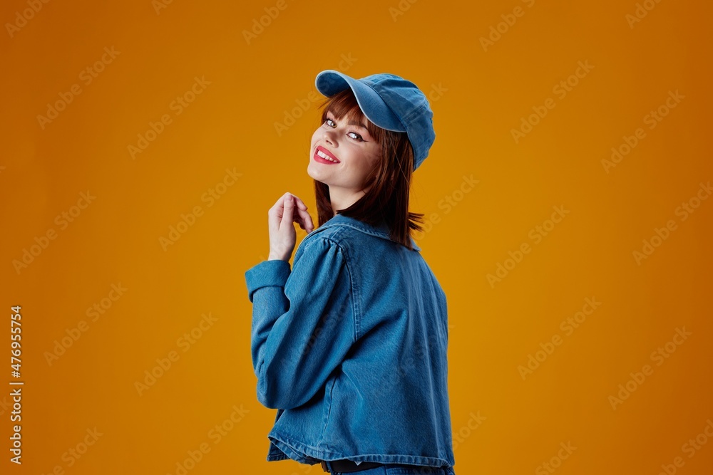 Portrait of a charming lady denim cap red lips glamor fashion color background unaltered Portrait of a charming lady denim cap red lips glamor fashion color background unaltered